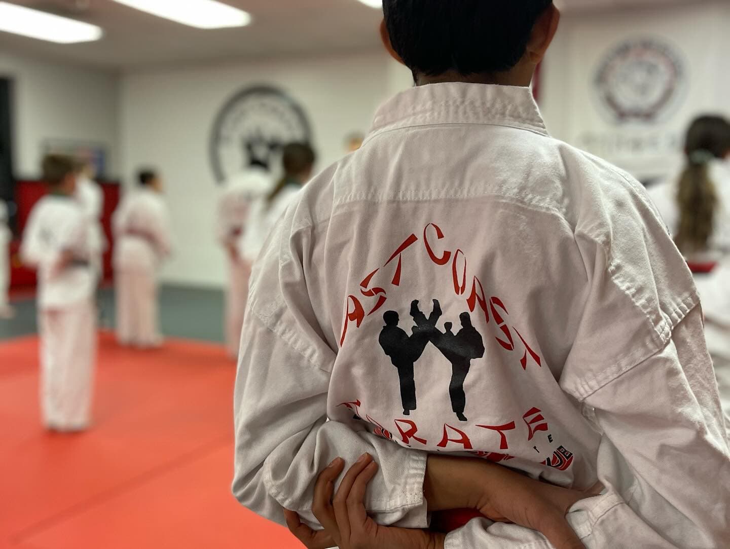 Young students training in boxing gloves during a Adults Martial Arts class at East Coast Karate