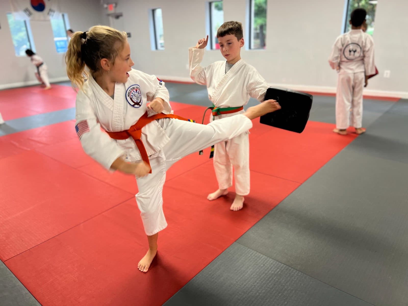 Coach working one-on-one with a student in class