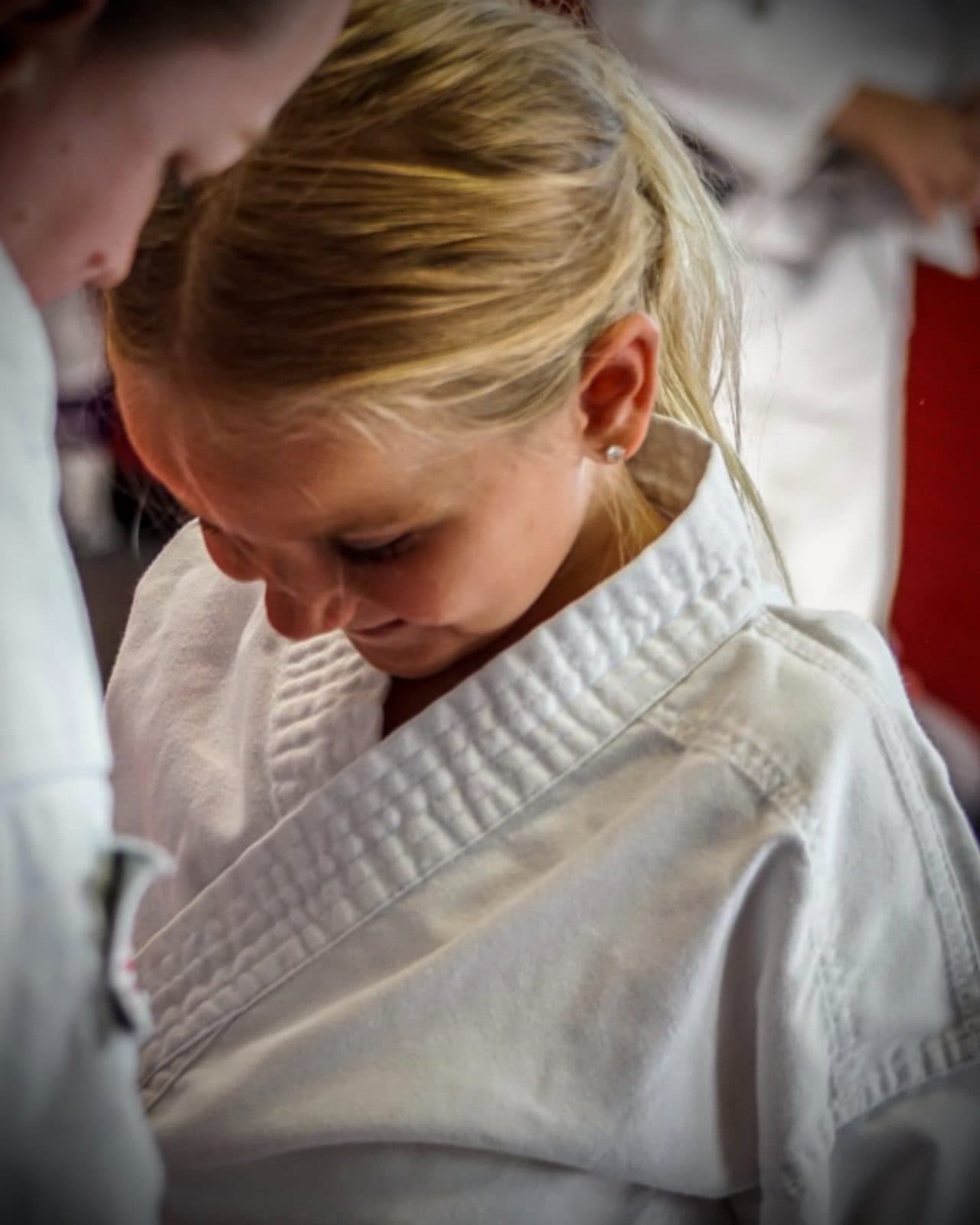 Adult member smiling during a kickboxing class at East Coast Karate