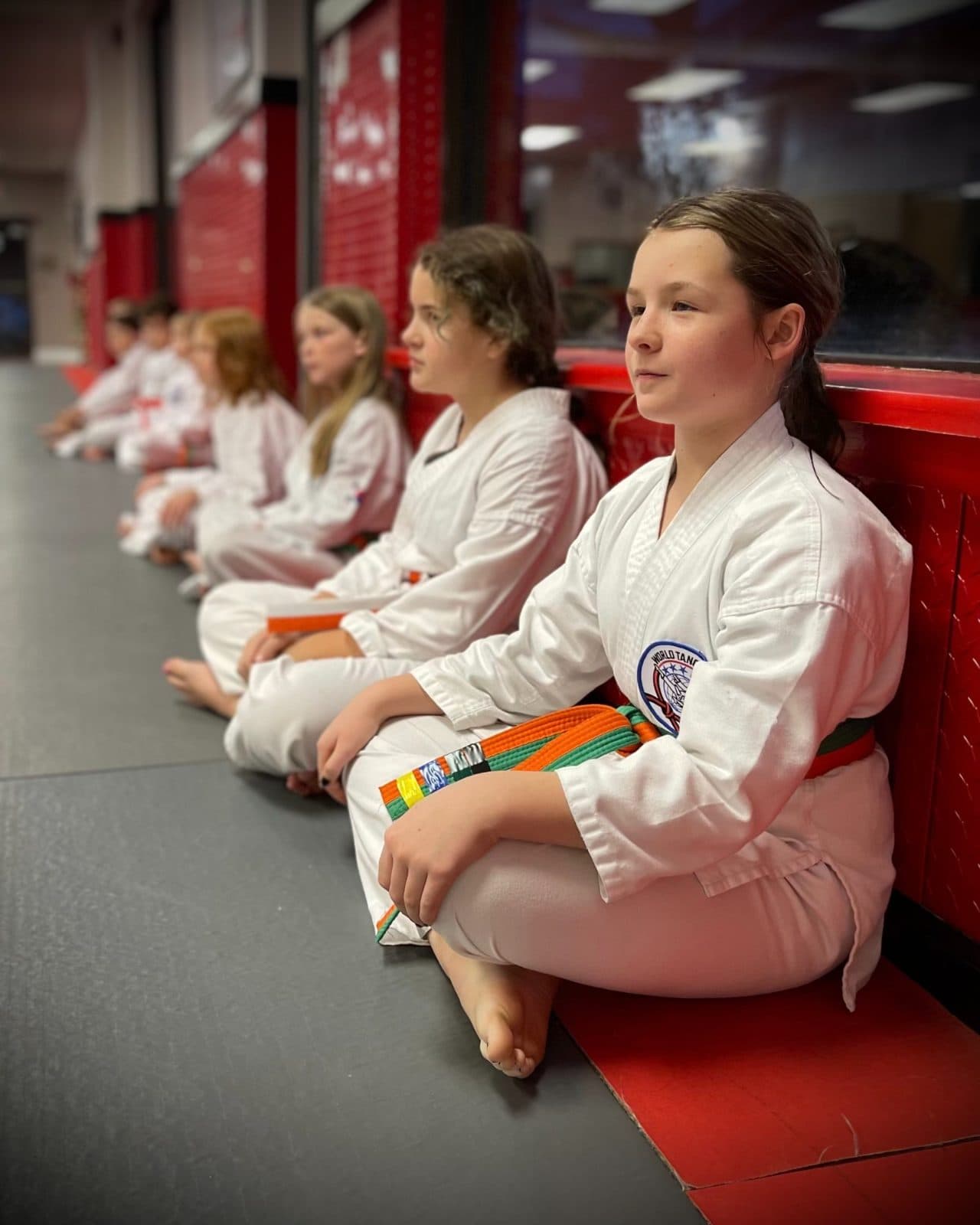 Adult student drilling punches on the pads at East Coast Karate