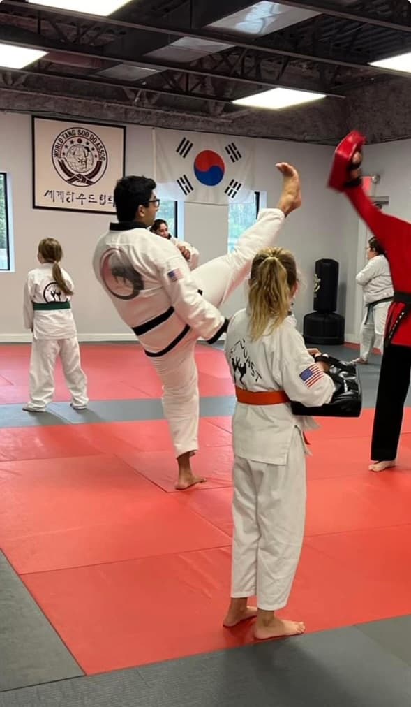 Smiling boy in a kids martial arts class at East Coast Karate